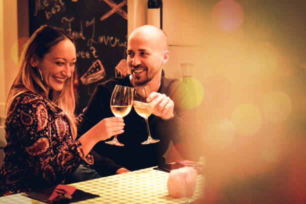 istock young couple having a drink in a restaurant 1050448686
