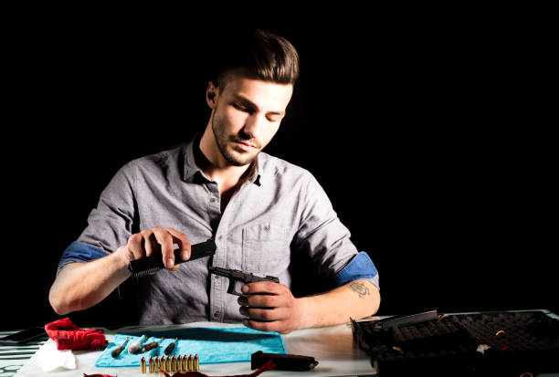 istock Keeping his gun in good working order 1050451438