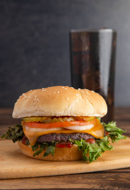 istock A Perfect Beef Hamburger with All the Fixings with an Ice Cold Soda 1050461552