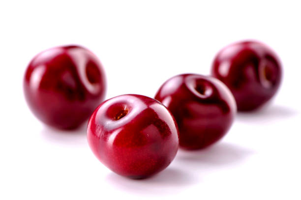 istock cherry berries close-up on white background 1050463722