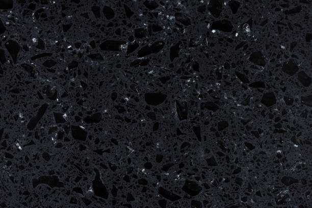 istock Shiny exquisite background of black  synthetic rock. 1050463962