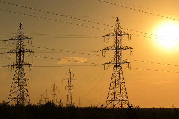 istock High voltage transmission lines at sunset. Energy and electrification. 1050479284