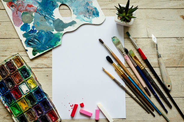 istock Creative artist workplace flat lay, mockup on wooden background 1050481778