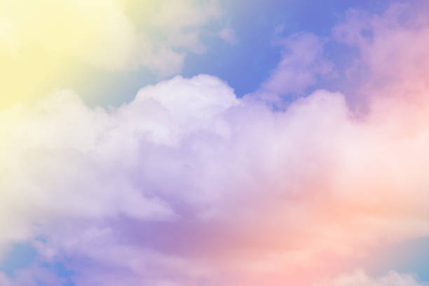 istock Sweet pastel colored cloud and sky with sun light, soft cloudy with gradient pastel color background. 1050482166