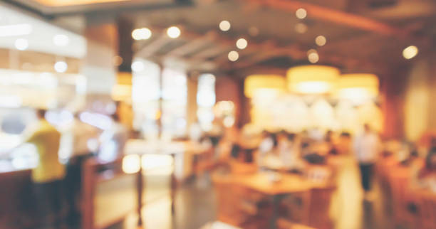 istock Restaurant interior with customer and wood table blur abstract background with bokeh light 1050482588