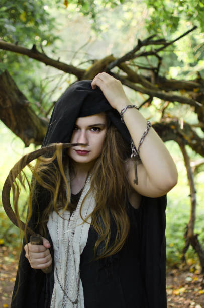 istock wicked witch with a sickle in her hands 1050482646