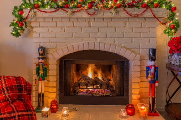 istock Christmas nutcracker soldiers and candles with brick fireplace  (P) 1050487832