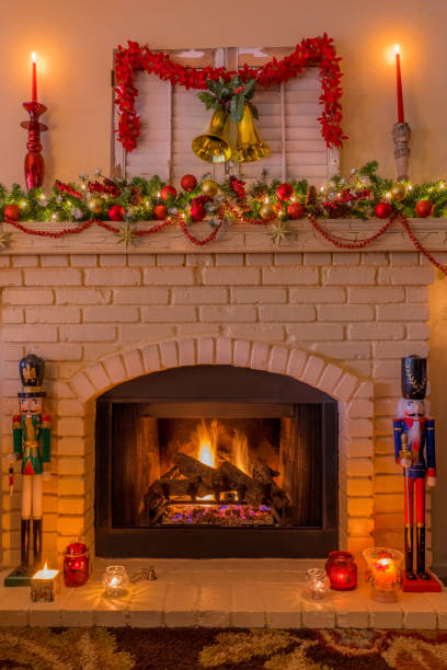 istock Christmas nutcracker soldiers and bells with brick fireplace  (P) 1050487872