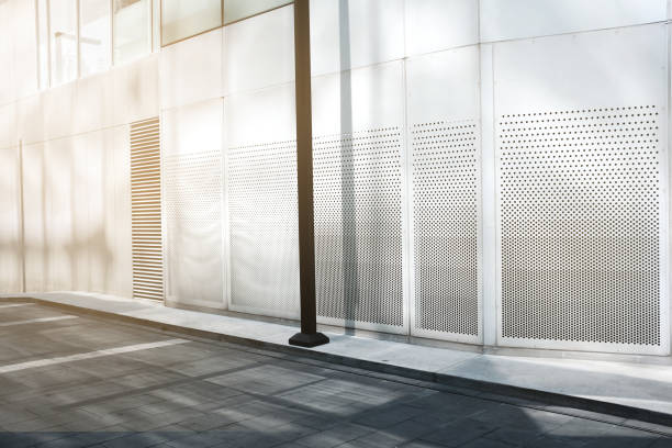 istock Modern office building outdoor and empty pavement 1050489096