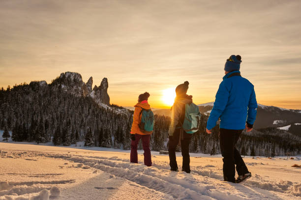 istock winter hiking friends 1050492714