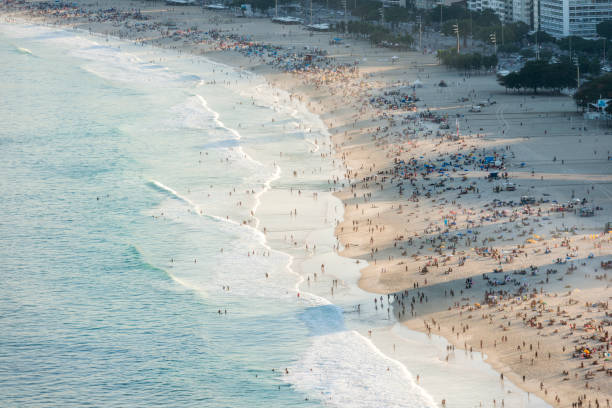istock Shadows and crowd people copacabana beach rio 1050492984