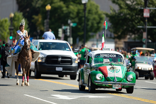 Washington, D.C., USA - September 29, 2018: The Fiesta DC Parade, Volkswagen Beetle Taxi, carrying the mexican flag