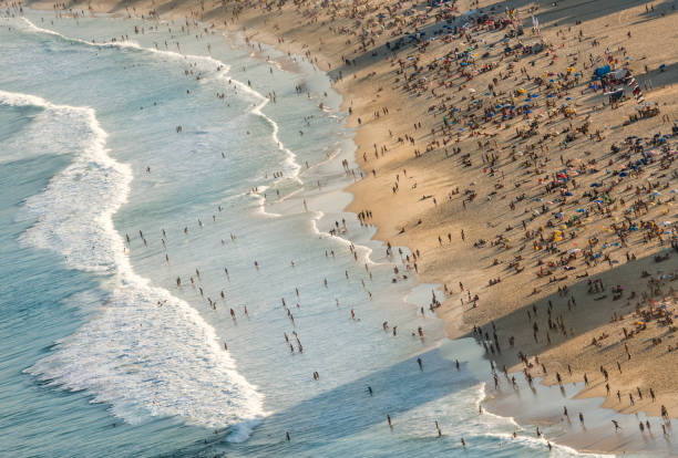 istock tilted crowd at Copacabana beach relax winter 1050495222