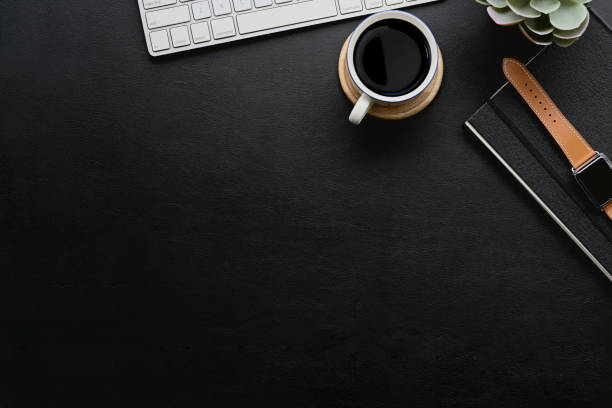 istock Dark leather desk with home office gadget and copy space. 1050511058