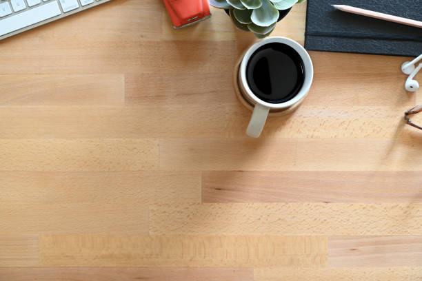 istock Office wood desk table with supplies. Top view stuff and copy space 1050513714