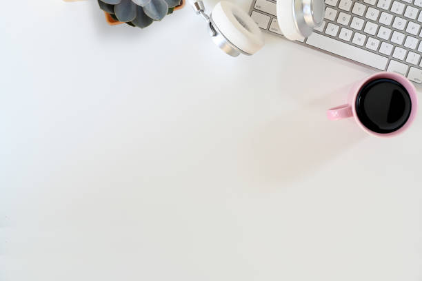 istock Top view shot of desk workplace with keyboard computer and copy space. 1050514042