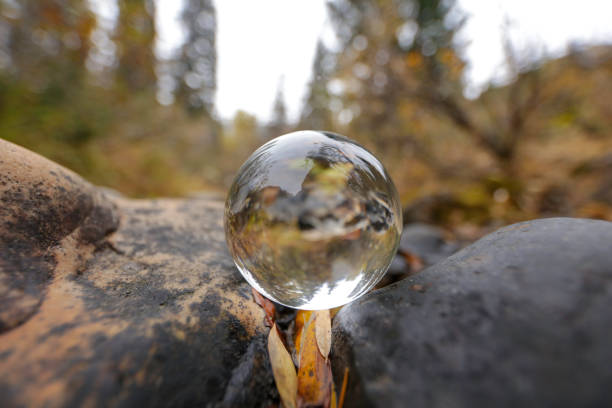 Glass ball next to river