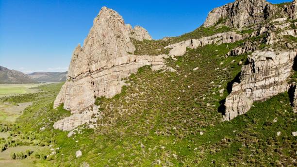 istock Jagged Mountain Peak Overlooking Driggs Mansion Ruins 1050522644