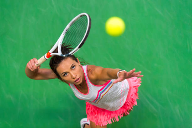 high angle view of woman playing tennis in court - tennis women one person vitality imagens e fotografias de stock