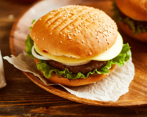 istock fresh burger, served on wooden board 1050544266
