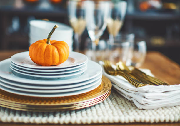 istock Thanksgiving table with orange pumpkin 1050551214