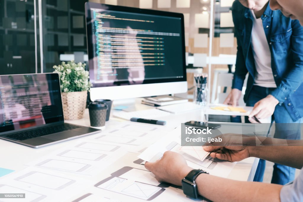 UX UI and Programming development technology. Programmer and UX UI designer working in a software development and coding technologies. Mobile and website design and programing development technology. User Experience Stock Photo