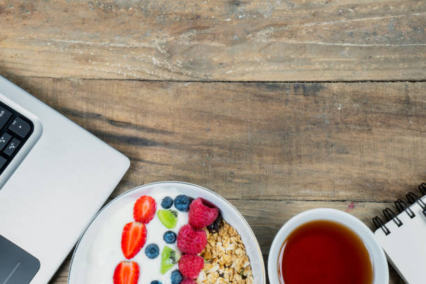 istock Laptop and tasty cereal on table 1050571502