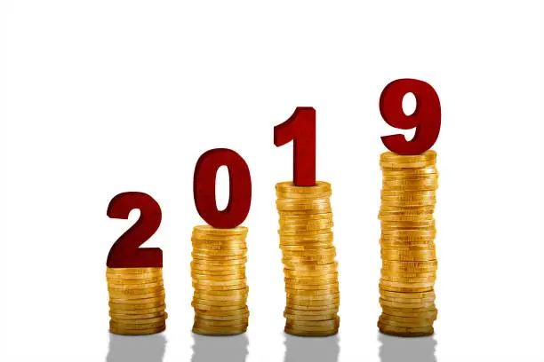Piles of gold coins are shaped growth chart with number 2019, isolated on white background