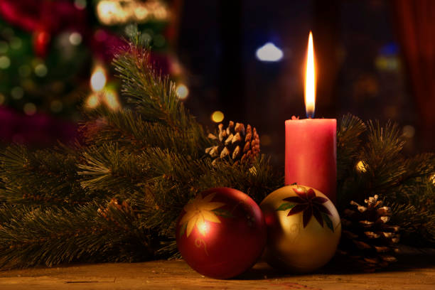 istock Two bauble ornaments and Christmas candle 1050572272