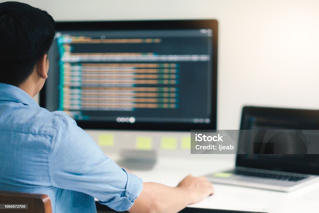 UX UI and Programming development technology. Programmer and UX UI designer working in a software development and coding technologies. Mobile and website design and programing development technology. Computer Programmer Stock Photo