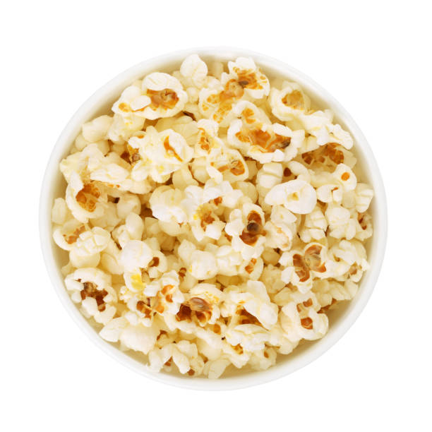 Popcorn in cardboard take out bucket isolated on white background. Top view