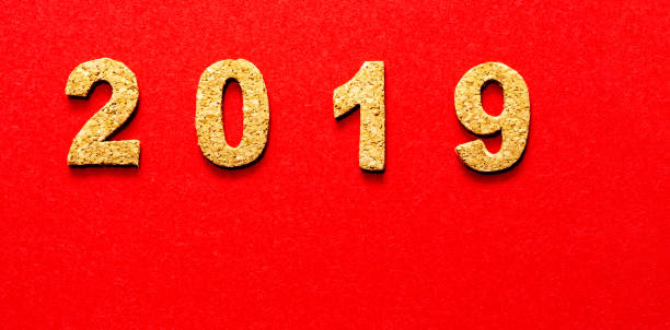istock New years resolution 2019 concept. cork year number on red color background with copy space 1050580024