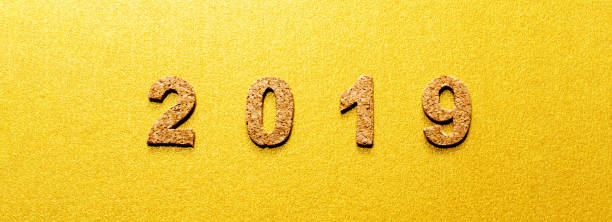 istock New years resolution 2019 concept. cork year number on gold color background with copy space 1050580102