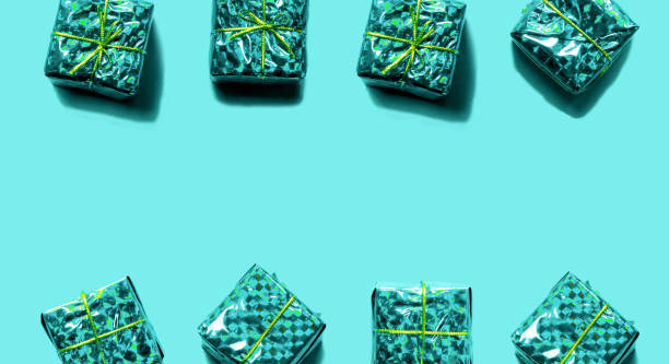 istock Christmas pattern made of blue gift boxes isolated on blue color background. 1050580110