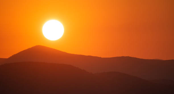 istock Sunrise, sunset over mountains silhouette. Colorful sky background, space, panoramic view. 1050585702