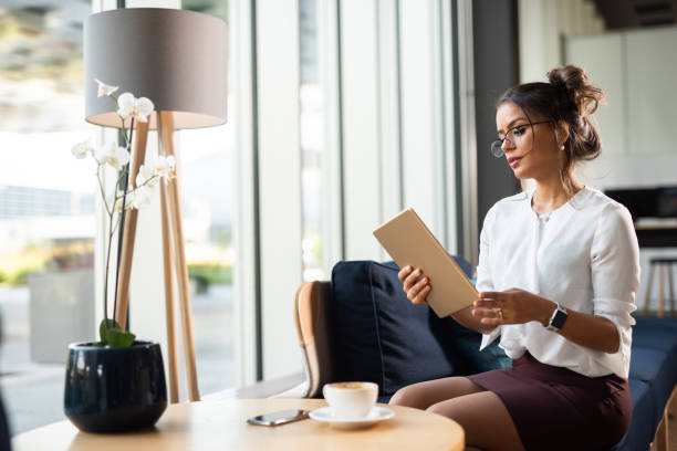 istock Brazilian businesswoman holding tablet computer. 1050613492