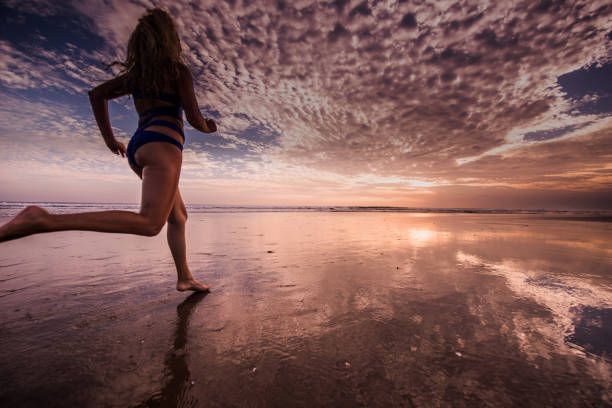 istock Jogging into the sea. 1050615854