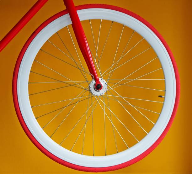 istock Fixed gear bicycle wheel with thin red tires and white wide rim 1050616166