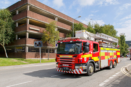 Swansea, UK: August 13, 2017: A Scania fire engine responds to an emergency call out. Scania is a major Swedish manufacturer of commercial vehicles – specifically heavy trucks and buses.