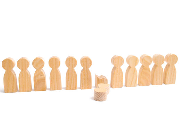 istock The concept of a weak link. Did not give up to expectations and did not fulfill the task. Weak player, worker for dismissal. A row of wooden people and a broken figure of a person among them. 1050628084