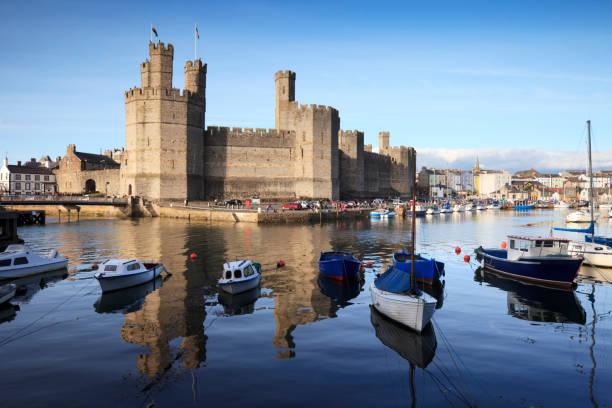 Caernarfon, UK- July 11, 2022: Caernarfon Castle and the swing bridge  in North Wales.