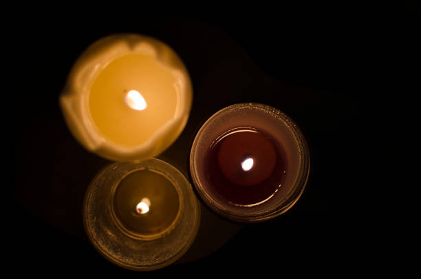 istock Fire candles in a dark room 1050634170