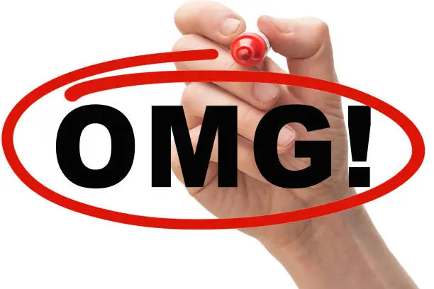 Photo of Hand drawing a red circle around the text #OMG.