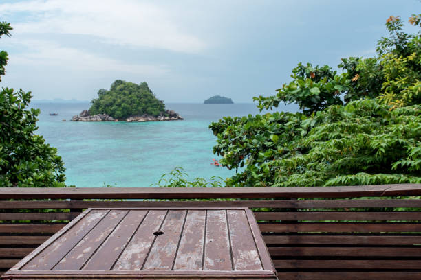 istock Wooden Table On The Sea View Terrace 1050643060