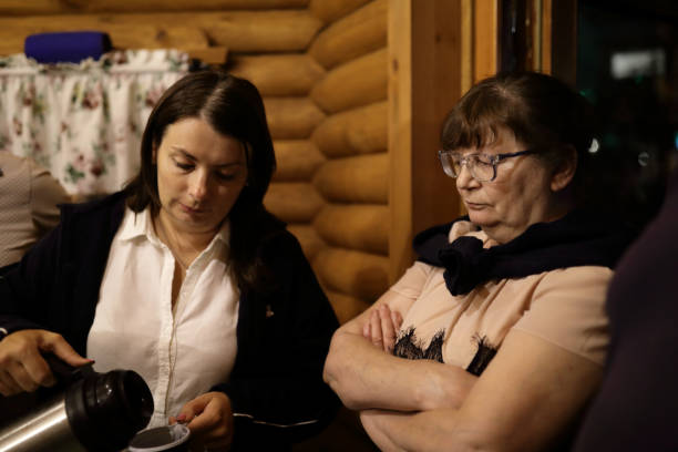 istock Two women in wooden hut 1050646762