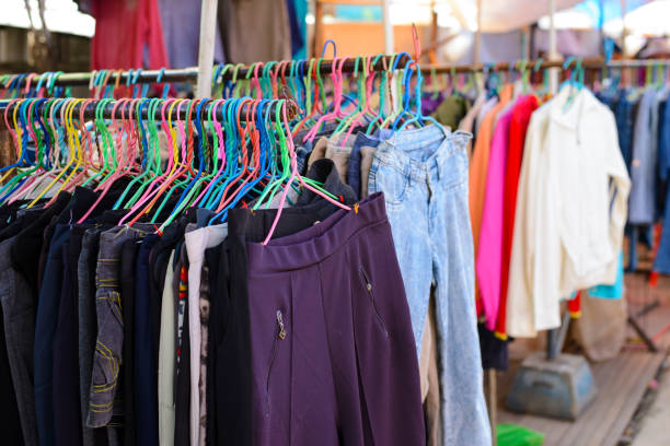 istock Pants and jeans on hangers in the second hand store 1050646954