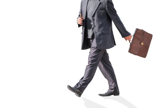 istock A man walks in a suit with a briefcase. 1050650536