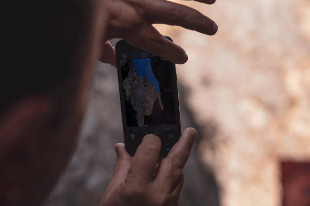istock Man taking a photo with smartphone 1050653618