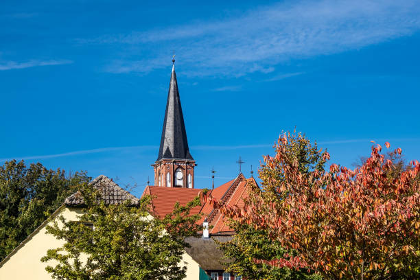 istock Church with blue sky in Wustrow, Germany 1050656078