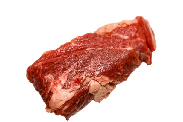 Raw marbled beef, brisket lying on white background. Isolated.